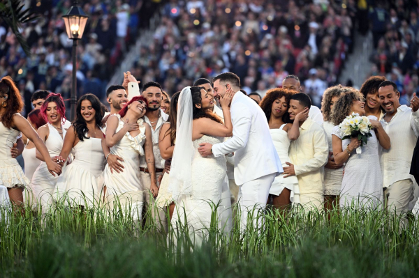 Performers portray a wedding during Puerto Rican singer Bad Bunny performance at Super Bowl LX Patriots vs Seahawks...