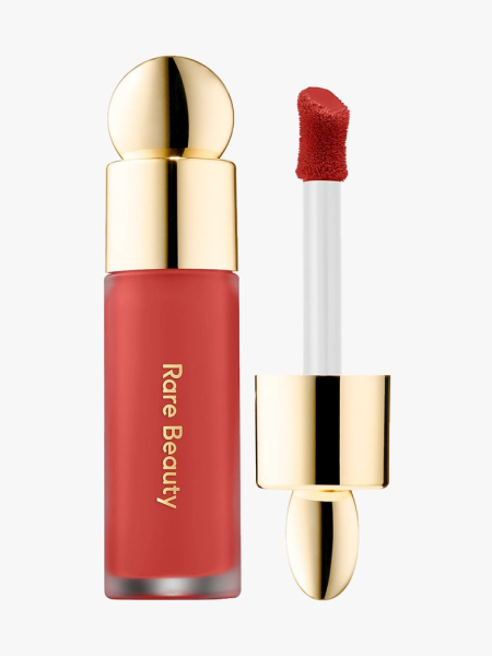 Rare Beauty Soft Pinch Liquid Blush in Love vial of red liquid blush with gold cap on light gray background