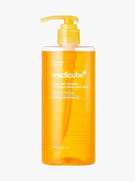 Medicube Kojic Acid Turmeric Brightening Body Wash bottle of orange body wash on light gray background